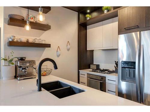 302-2702 17 Avenue Sw, Calgary, AB - Indoor Photo Showing Kitchen With Stainless Steel Kitchen With Double Sink