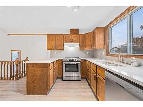 211 Sandstone Drive Nw, Calgary, AB - Indoor Photo Showing Kitchen With Double Sink