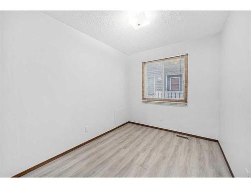 211 Sandstone Drive Nw, Calgary, AB - Indoor Photo Showing Other Room