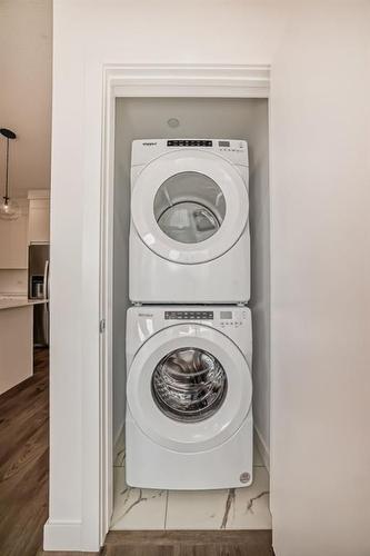 3405-111 Wolf Creek Drive Se, Calgary, AB - Indoor Photo Showing Laundry Room