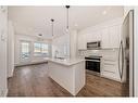 3405-111 Wolf Creek Drive Se, Calgary, AB  - Indoor Photo Showing Kitchen With Stainless Steel Kitchen With Double Sink With Upgraded Kitchen 