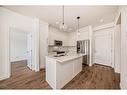 3405-111 Wolf Creek Drive Se, Calgary, AB  - Indoor Photo Showing Kitchen With Double Sink 