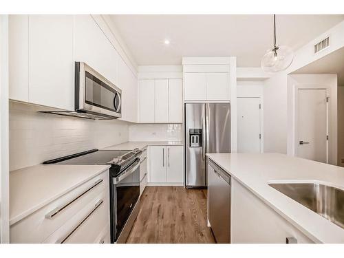 3405-111 Wolf Creek Drive Se, Calgary, AB - Indoor Photo Showing Kitchen With Stainless Steel Kitchen