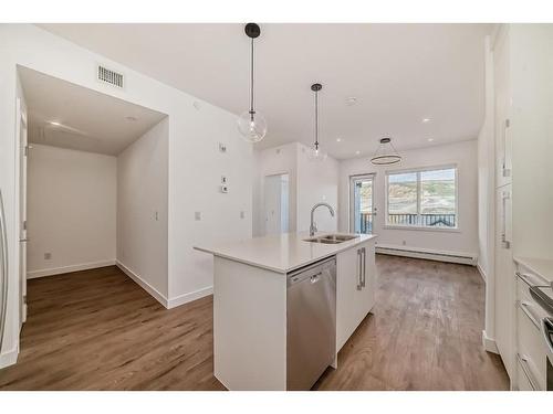 3405-111 Wolf Creek Drive Se, Calgary, AB - Indoor Photo Showing Kitchen With Double Sink With Upgraded Kitchen