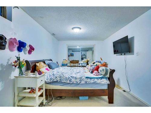 99 Coral Springs Boulevard Ne, Calgary, AB - Indoor Photo Showing Bedroom