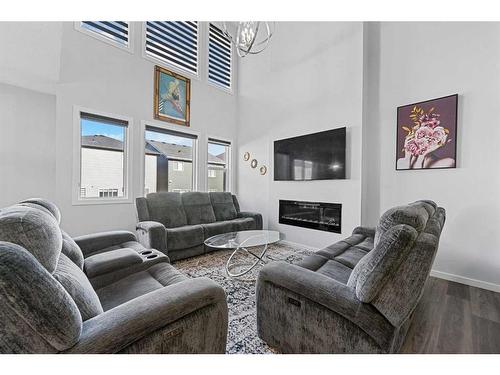 148 Savanna Drive Ne, Calgary, AB - Indoor Photo Showing Living Room With Fireplace