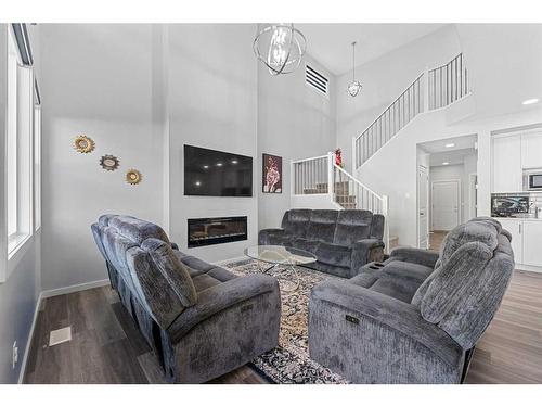 148 Savanna Drive Ne, Calgary, AB - Indoor Photo Showing Other Room With Fireplace