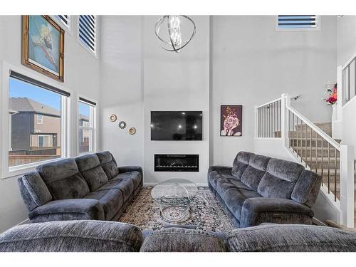 148 Savanna Drive Ne, Calgary, AB - Indoor Photo Showing Living Room With Fireplace