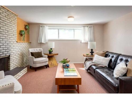 16 Capri Avenue Nw, Calgary, AB - Indoor Photo Showing Living Room With Fireplace