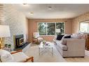 16 Capri Avenue Nw, Calgary, AB  - Indoor Photo Showing Living Room With Fireplace 