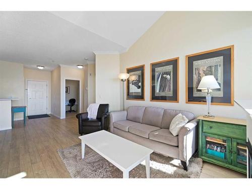 1310-1010 Arbour Lake Road Nw, Calgary, AB - Indoor Photo Showing Living Room