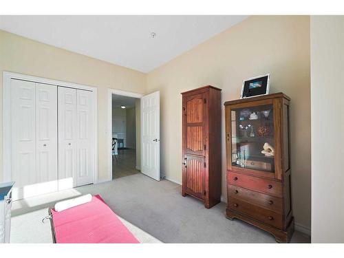 1310-1010 Arbour Lake Road Nw, Calgary, AB - Indoor Photo Showing Bedroom