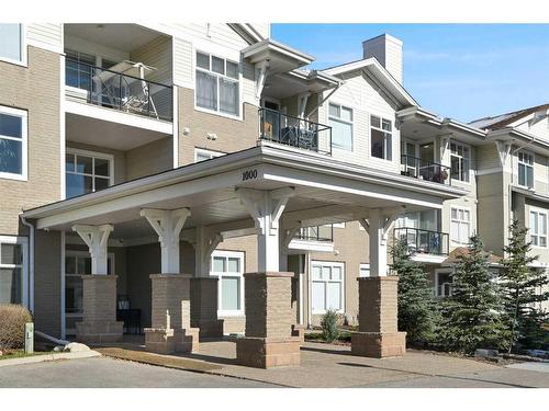 1310-1010 Arbour Lake Road Nw, Calgary, AB - Outdoor With Balcony With Facade