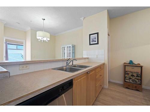 1310-1010 Arbour Lake Road Nw, Calgary, AB - Indoor Photo Showing Kitchen With Double Sink