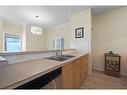 1310-1010 Arbour Lake Road Nw, Calgary, AB  - Indoor Photo Showing Kitchen With Double Sink 