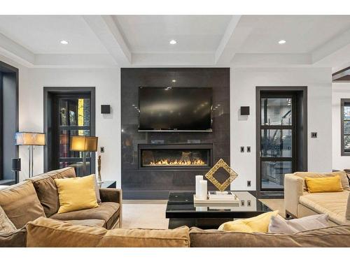 58 Posthill Drive Sw, Calgary, AB - Indoor Photo Showing Living Room With Fireplace