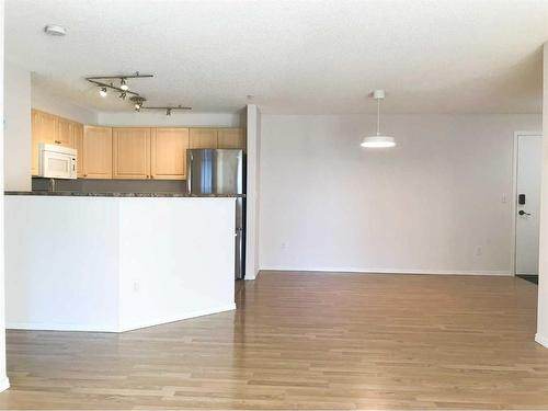 3307-4975 130 Avenue Se, Calgary, AB - Indoor Photo Showing Living Room With Fireplace