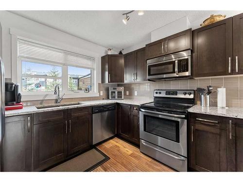 427 Covecreek Circle Ne, Calgary, AB - Indoor Photo Showing Kitchen With Stainless Steel Kitchen With Double Sink