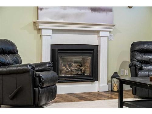 1131 Lake Bonavista Drive Se, Calgary, AB - Indoor Photo Showing Living Room With Fireplace