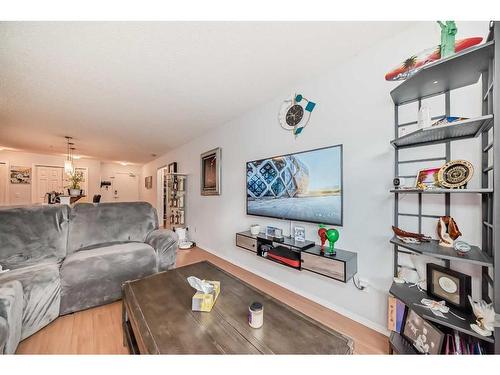 2105-700 Willowbrook Road Nw, Airdrie, AB - Indoor Photo Showing Living Room