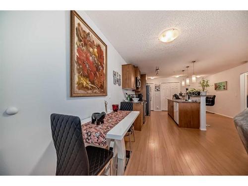 2105-700 Willowbrook Road Nw, Airdrie, AB - Indoor Photo Showing Dining Room