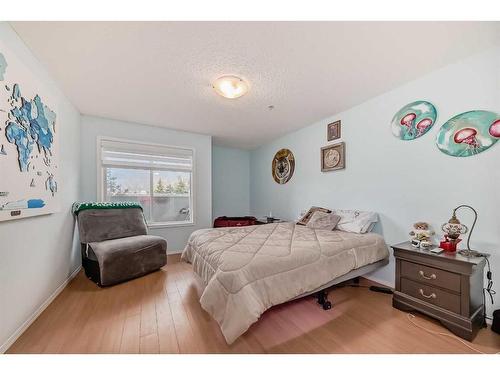 2105-700 Willowbrook Road Nw, Airdrie, AB - Indoor Photo Showing Bedroom