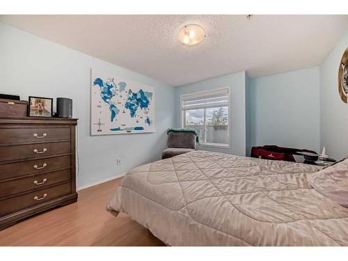 2105-700 Willowbrook Road Nw, Airdrie, AB - Indoor Photo Showing Bedroom