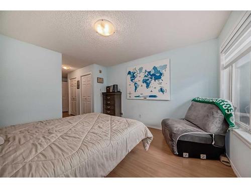 2105-700 Willowbrook Road Nw, Airdrie, AB - Indoor Photo Showing Bedroom