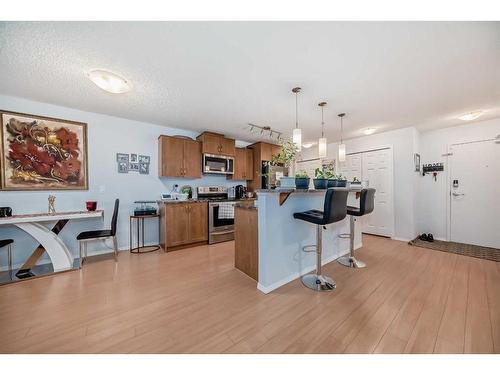 2105-700 Willowbrook Road Nw, Airdrie, AB - Indoor Photo Showing Kitchen