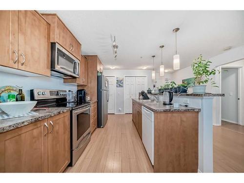 2105-700 Willowbrook Road Nw, Airdrie, AB - Indoor Photo Showing Kitchen With Stainless Steel Kitchen