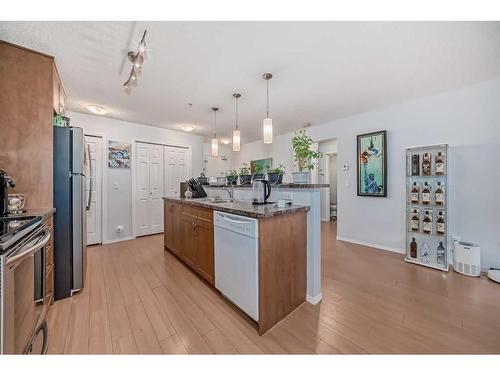 2105-700 Willowbrook Road Nw, Airdrie, AB - Indoor Photo Showing Kitchen