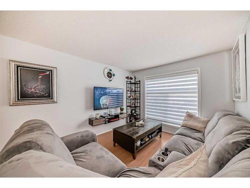 2105-700 Willowbrook Road Nw, Airdrie, AB - Indoor Photo Showing Living Room