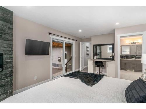 363 Acadia Drive Se, Calgary, AB - Indoor Photo Showing Bedroom With Fireplace