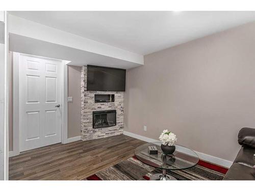 363 Acadia Drive Se, Calgary, AB - Indoor Photo Showing Living Room With Fireplace