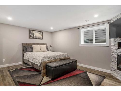 363 Acadia Drive Se, Calgary, AB - Indoor Photo Showing Bedroom With Fireplace