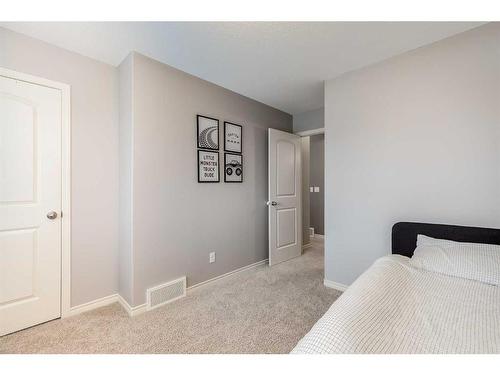 2587 Reunion Square Nw, Airdrie, AB - Indoor Photo Showing Bedroom