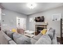 2587 Reunion Square Nw, Airdrie, AB  - Indoor Photo Showing Living Room With Fireplace 