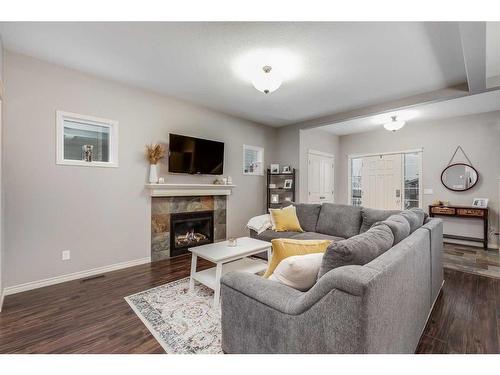 2587 Reunion Square Nw, Airdrie, AB - Indoor Photo Showing Living Room With Fireplace