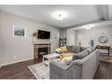 2587 Reunion Square Nw, Airdrie, AB  - Indoor Photo Showing Living Room With Fireplace 