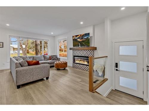 4216 Chippewa Road Nw, Calgary, AB - Indoor Photo Showing Living Room With Fireplace