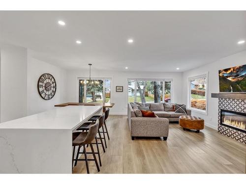 4216 Chippewa Road Nw, Calgary, AB - Indoor Photo Showing Living Room With Fireplace