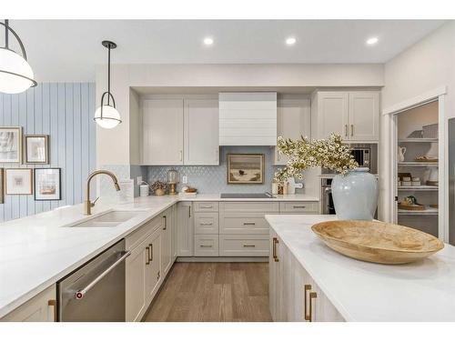 80 Magnolia Green Se, Calgary, AB - Indoor Photo Showing Kitchen With Double Sink With Upgraded Kitchen