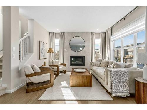 80 Magnolia Green Se, Calgary, AB - Indoor Photo Showing Living Room With Fireplace