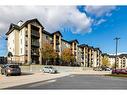 8105-304 Mackenzie Way Sw, Airdrie, AB  - Outdoor With Facade 