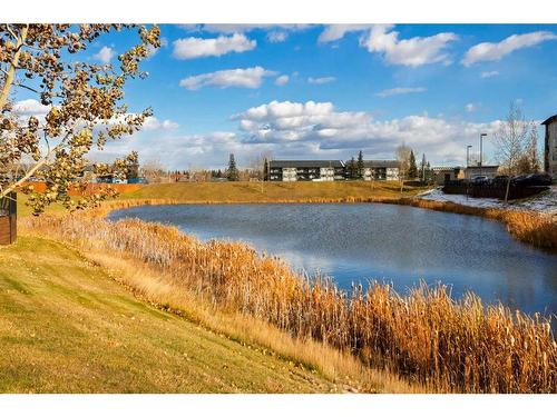 8105-304 Mackenzie Way Sw, Airdrie, AB - Outdoor With Body Of Water With View