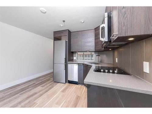 314-1087 2 Avenue Nw, Calgary, AB - Indoor Photo Showing Kitchen