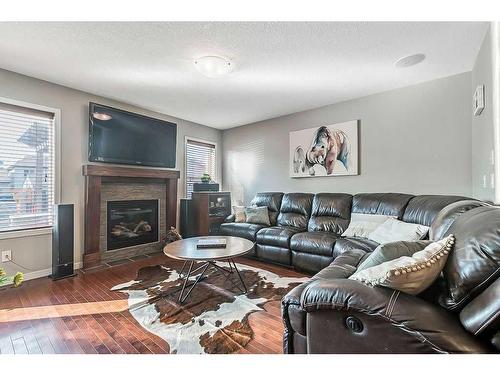 75 Cranford Crescent Se, Calgary, AB - Indoor Photo Showing Living Room With Fireplace