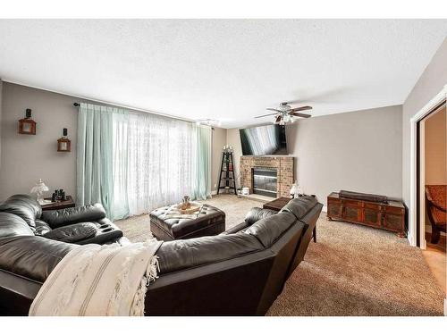 701 9 Street Se, High River, AB - Indoor Photo Showing Living Room With Fireplace