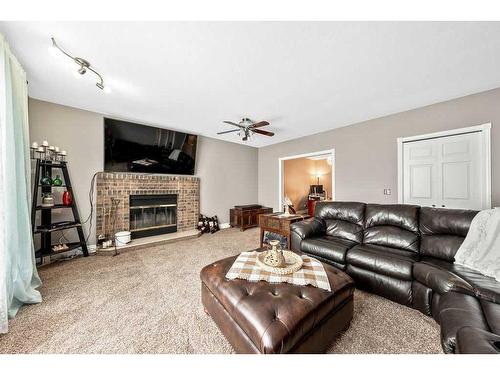 701 9 Street Se, High River, AB - Indoor Photo Showing Living Room With Fireplace