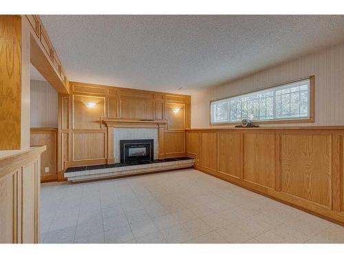 106 Huntham Place Ne, Calgary, AB - Indoor Photo Showing Living Room With Fireplace